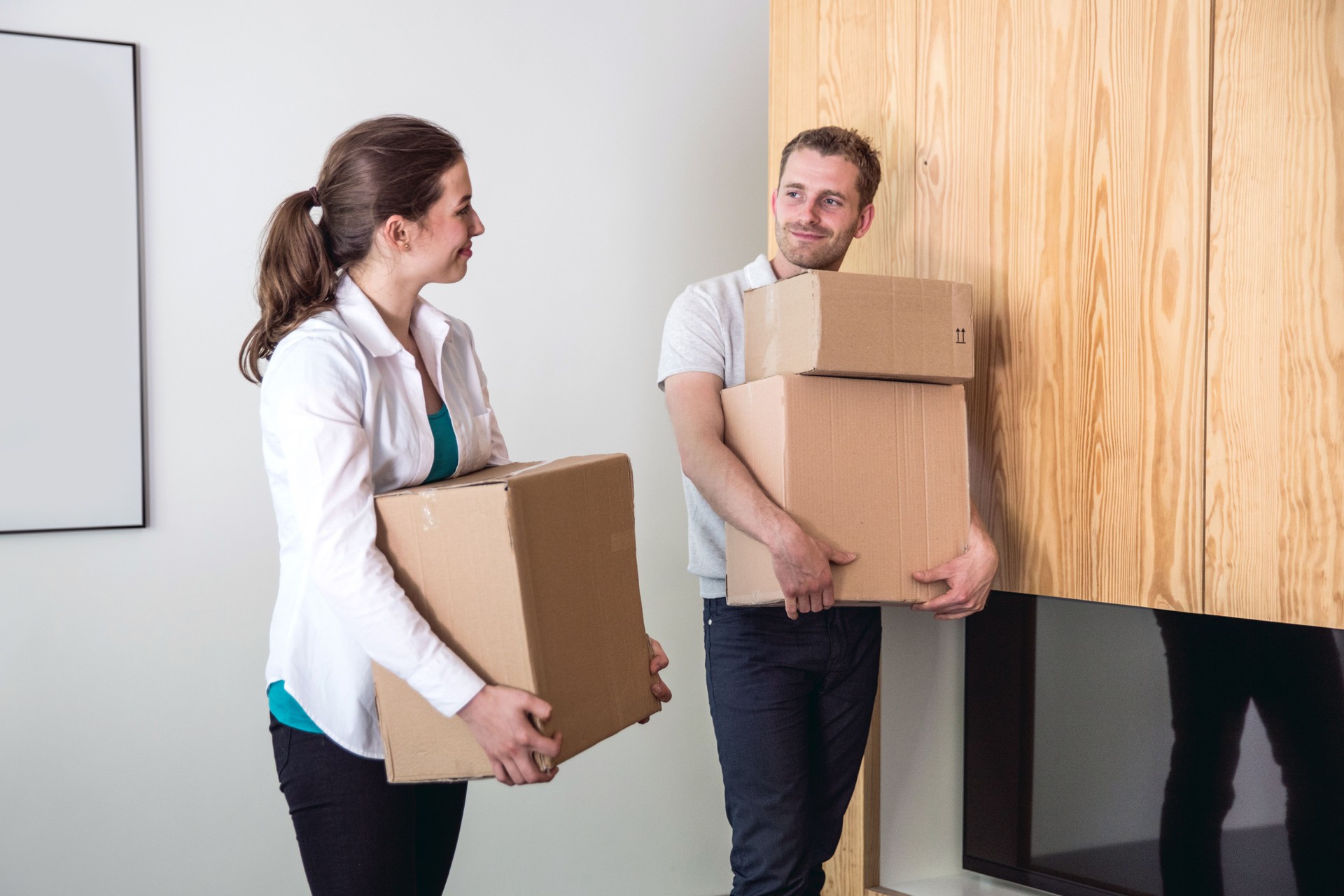 Young couple Moving Into a New House